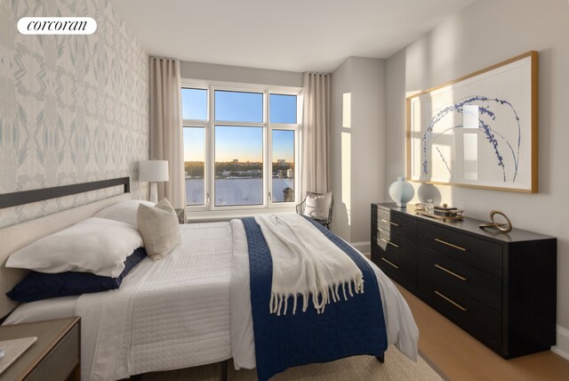 bedroom featuring a water view
