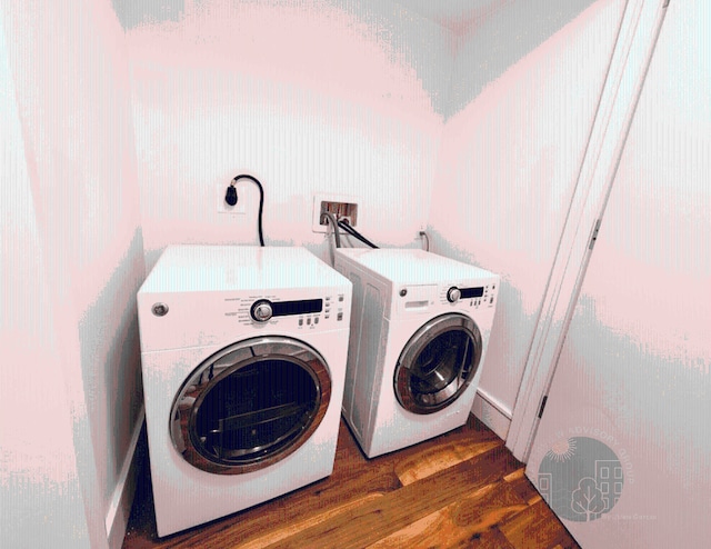 laundry area with washer and dryer and dark hardwood / wood-style floors