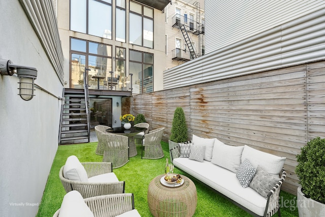 view of patio / terrace with an outdoor hangout area and stairway