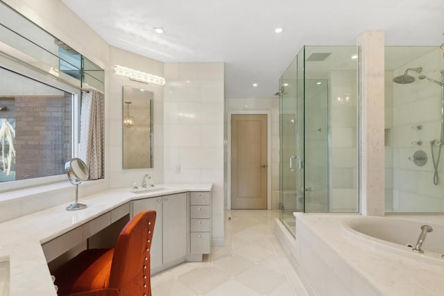 bathroom featuring vanity, tile patterned floors, and shower with separate bathtub