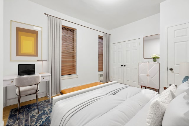 bedroom with a closet and wood finished floors