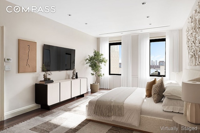 bedroom featuring recessed lighting, baseboards, and wood finished floors