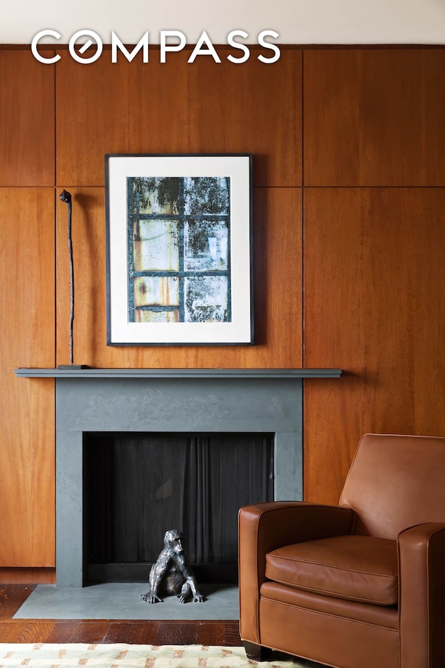 sitting room with a fireplace with flush hearth