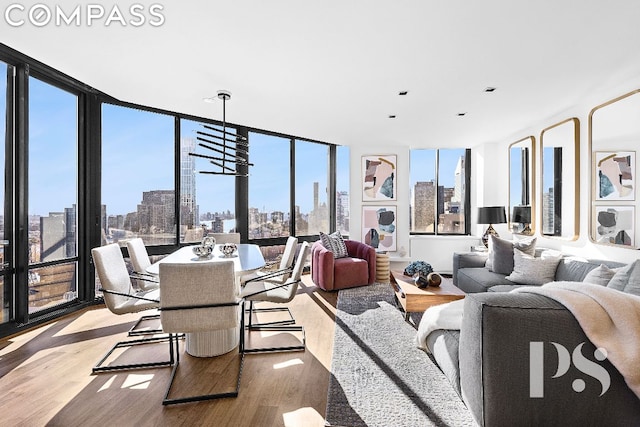 living room featuring hardwood / wood-style floors and a notable chandelier