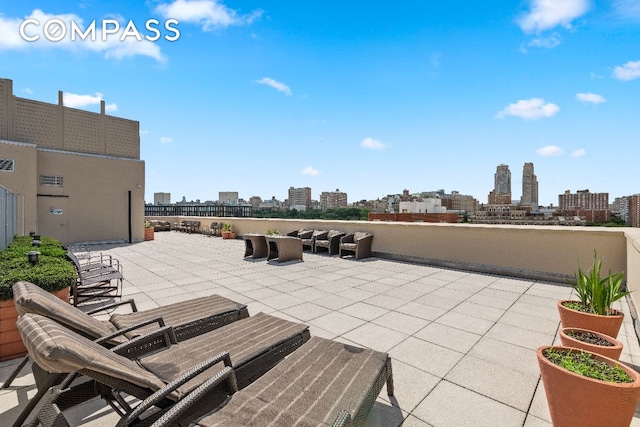 view of patio / terrace featuring a view of city