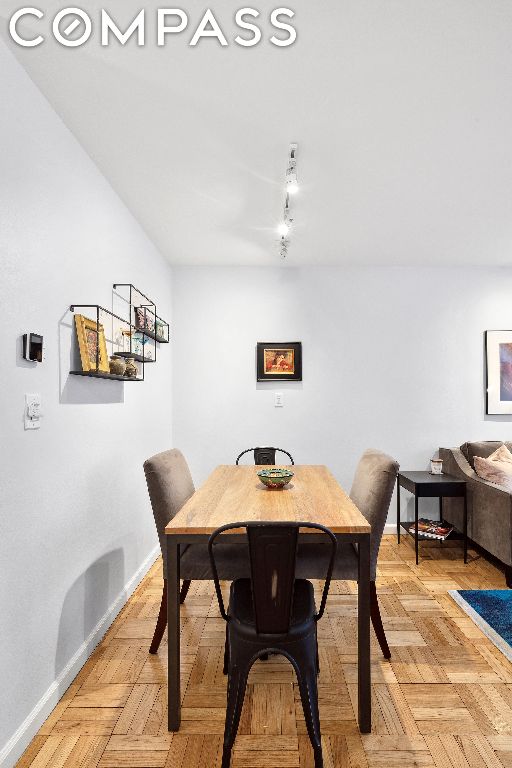 dining area featuring light parquet floors