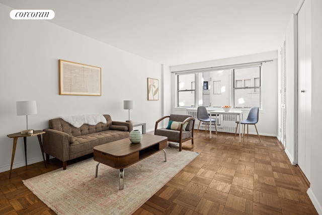 living room featuring parquet flooring