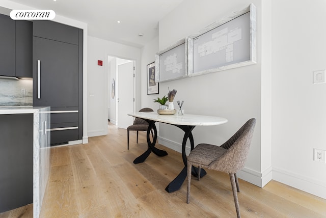 dining space featuring light wood-type flooring