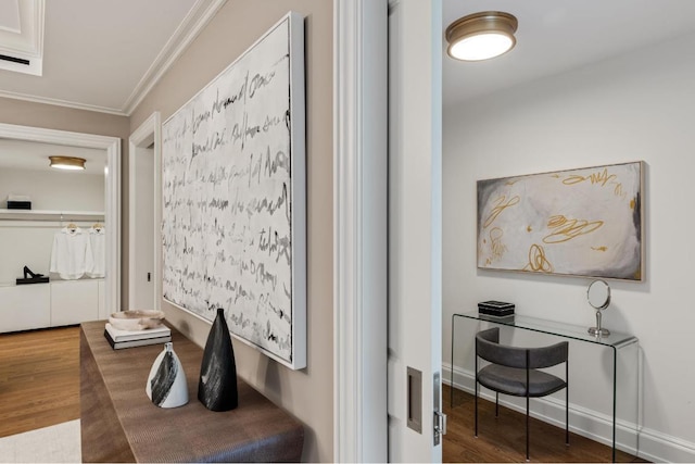 hallway with dark hardwood / wood-style flooring and crown molding