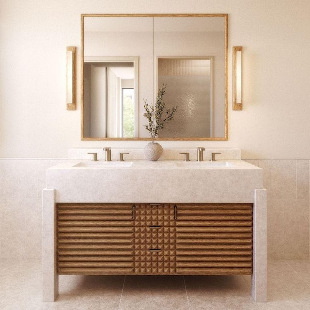 bathroom with tile patterned flooring, vanity, and tile walls