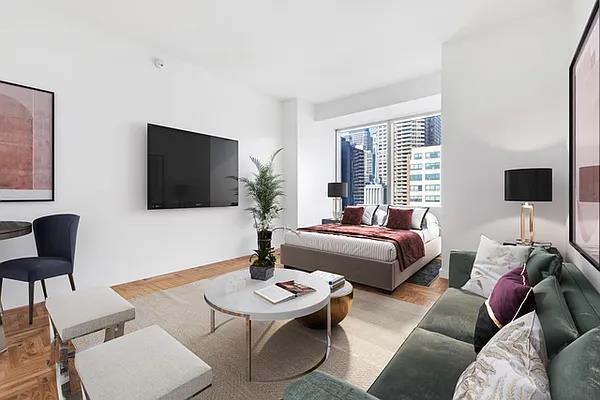 845 United Nations Plz Unit 15-F, New York City, NY 10017 - living room featuring wood finished floors