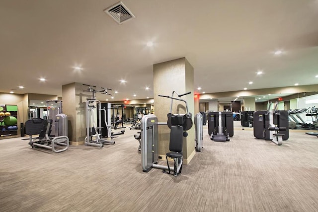 workout area featuring light carpet