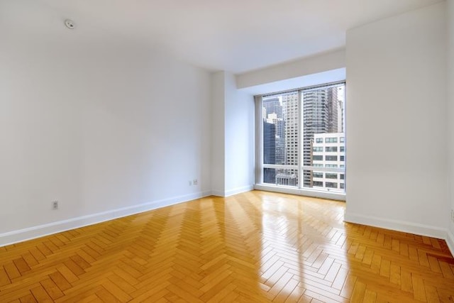 empty room featuring baseboards