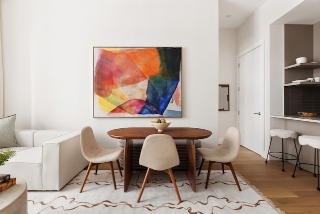 dining space with light wood-type flooring