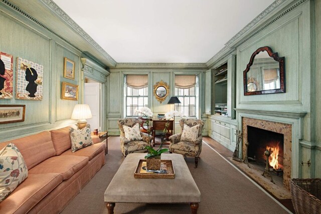 carpeted bedroom with a notable chandelier and ornamental molding