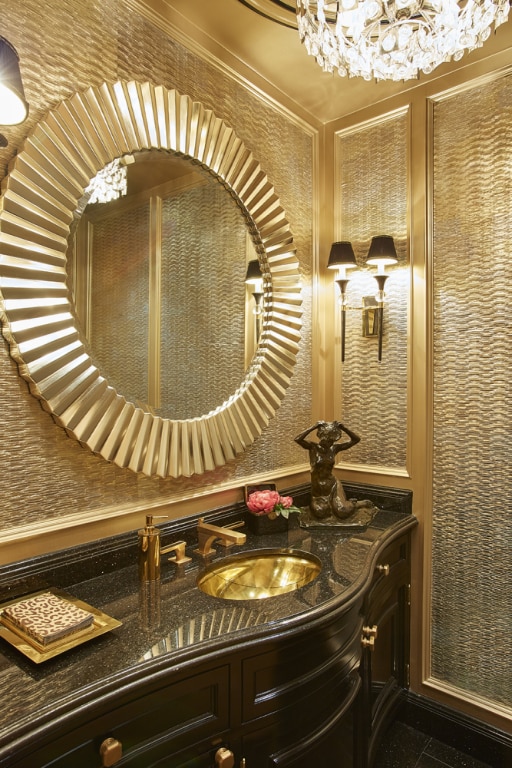 bathroom featuring vanity and a notable chandelier