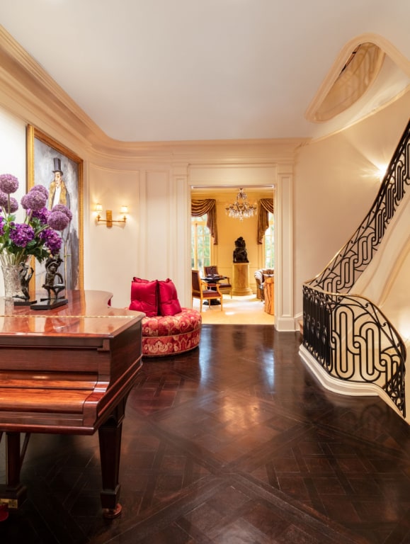 interior space featuring an inviting chandelier and parquet flooring