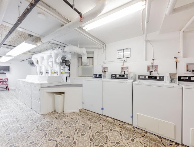 common laundry area featuring independent washer and dryer