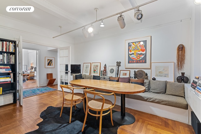 dining space with french doors and ornamental molding