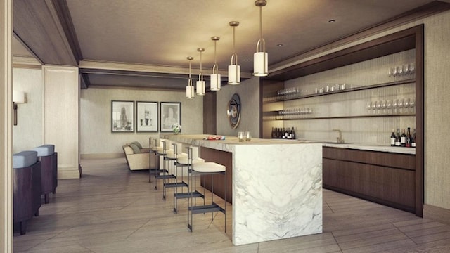 bar featuring pendant lighting and ornamental molding