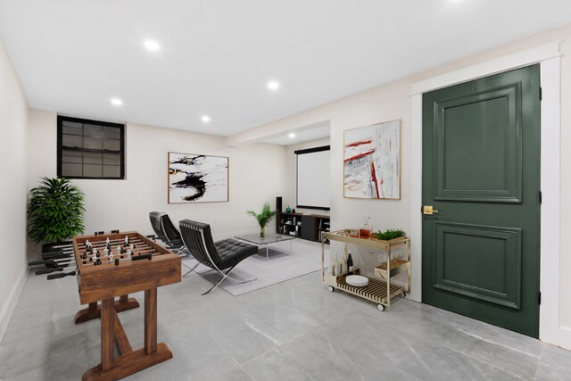 entrance foyer featuring light wood-type flooring and beamed ceiling