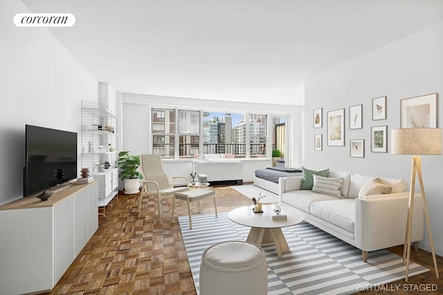 living room featuring dark parquet floors