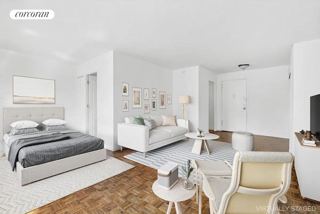 bedroom featuring dark parquet floors