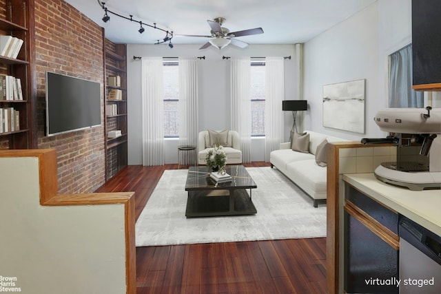 living room featuring dark hardwood / wood-style flooring, track lighting, and ceiling fan