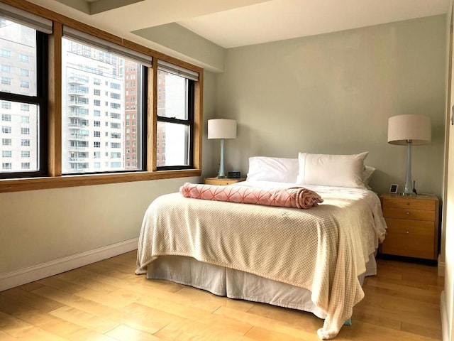 bedroom with light hardwood / wood-style flooring