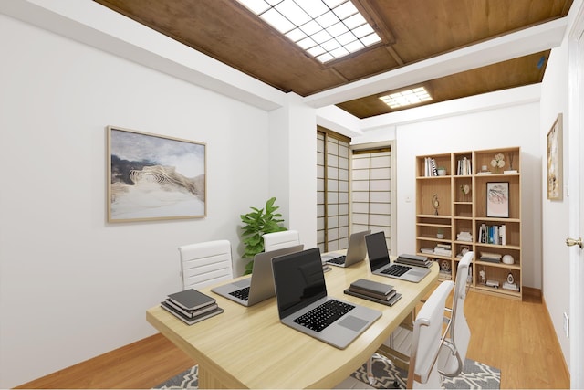 office with light wood-style flooring and wood ceiling