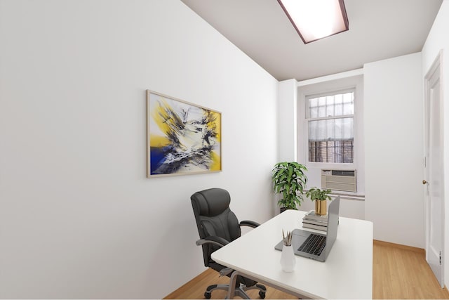 home office featuring cooling unit and light wood finished floors