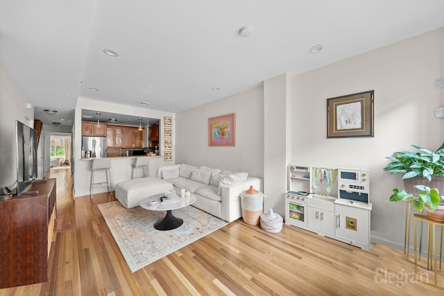 living area featuring recessed lighting and light wood-type flooring