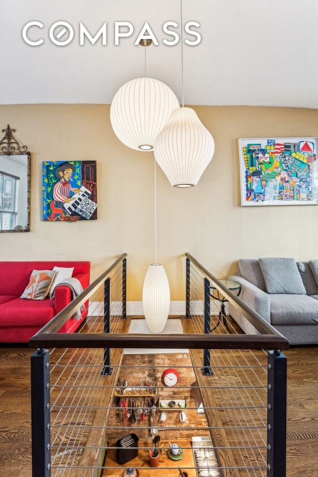 living room with baseboards and dark wood finished floors