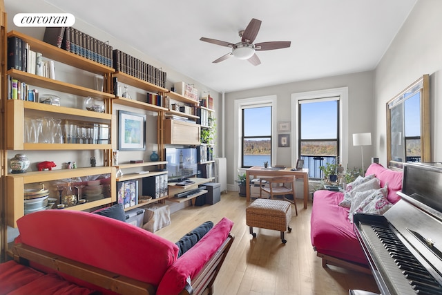 living room featuring ceiling fan and wood finished floors