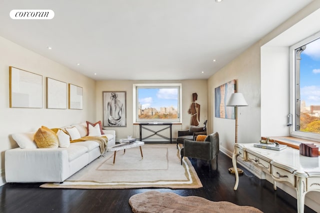 living room featuring recessed lighting, visible vents, a wealth of natural light, and wood finished floors