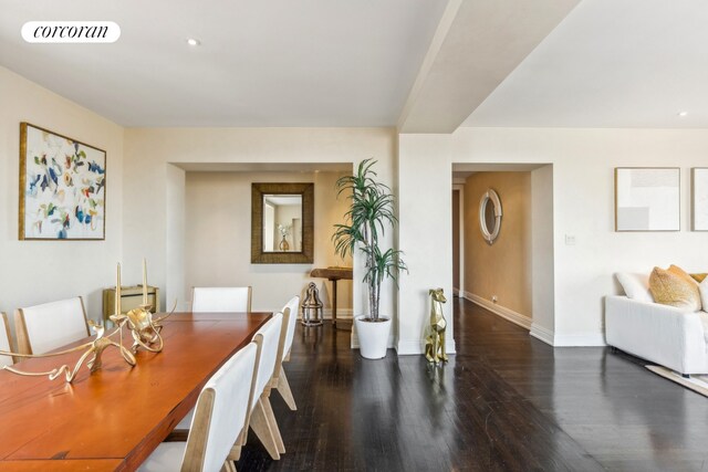 living room with hardwood / wood-style flooring and built in shelves