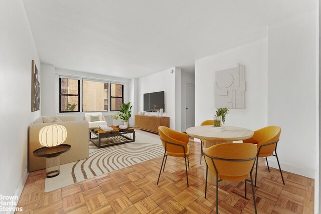 dining room with light parquet floors