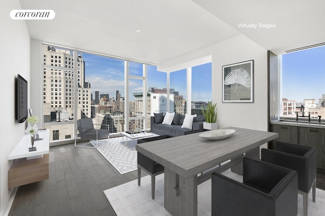 dining room featuring a view of city, floor to ceiling windows, dark wood-style floors, and visible vents