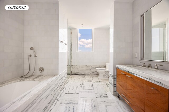 45 E 22nd St Unit 26B, New York City, NY 10010 - full bath featuring vanity, a tub with marble appearance, and tiled shower