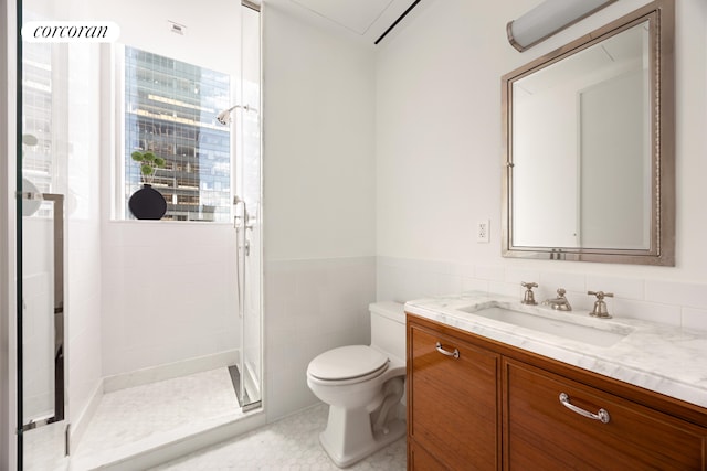 45 E 22nd St Unit 26B, New York City, NY 10010 - full bath with vanity, toilet, a stall shower, tile walls, and tile patterned floors