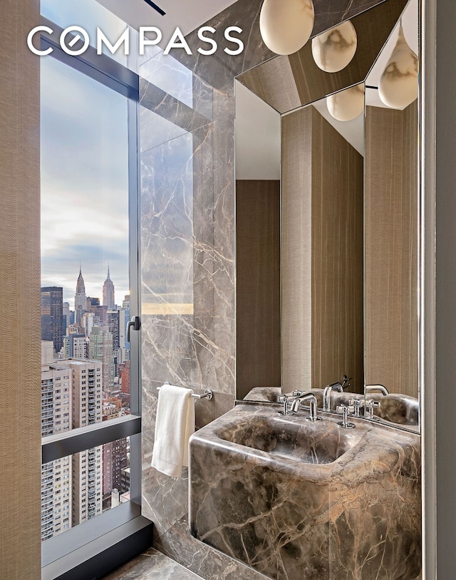bathroom featuring a city view