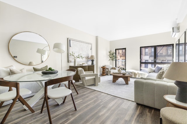 living room with dark hardwood / wood-style floors and a wall mounted air conditioner