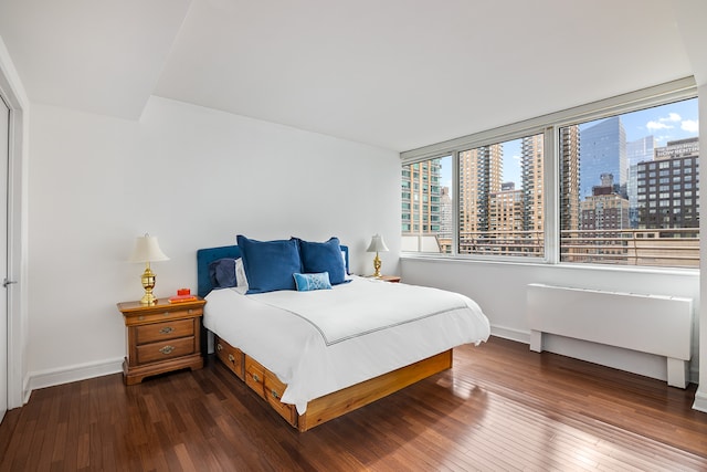 120 Riverside Blvd Unit 16K, New York City, NY 10069 - bedroom with a city view, multiple windows, wood finished floors, and baseboards