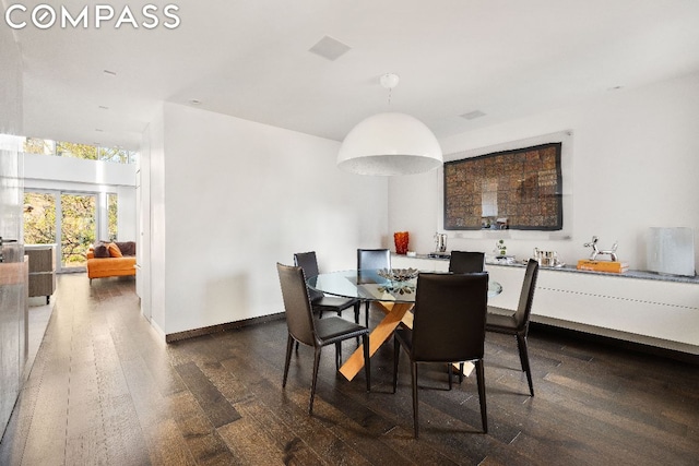 dining area featuring dark hardwood / wood-style floors