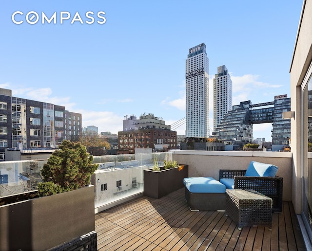 wooden deck featuring a view of city