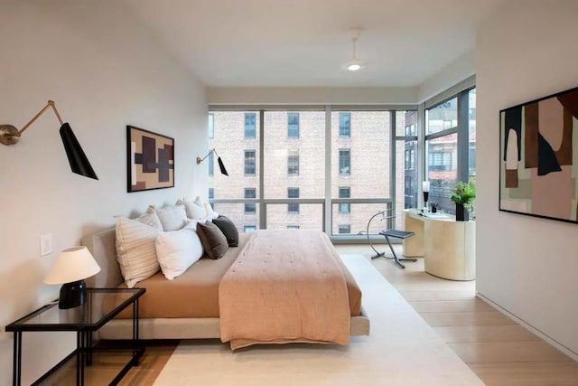 bedroom with light hardwood / wood-style flooring