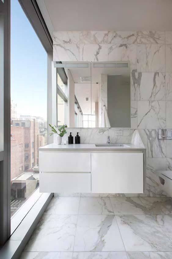 full bathroom with marble finish flooring and double vanity