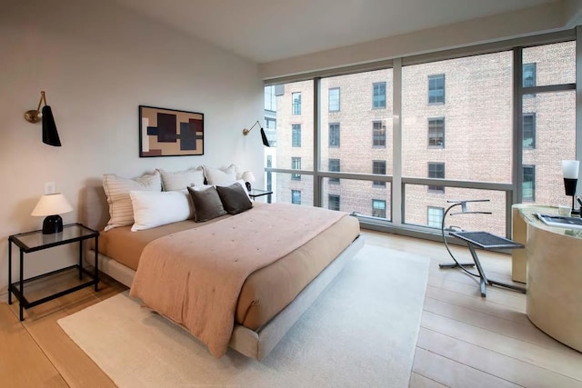 bedroom with light wood-type flooring