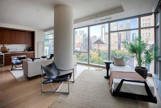 community lobby featuring floor to ceiling windows and a city view