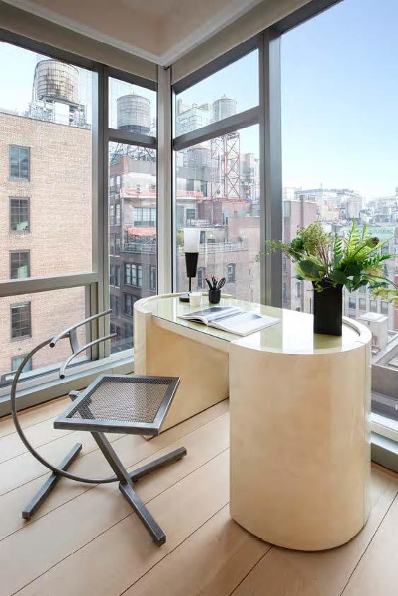 home office featuring a view of city and expansive windows